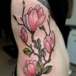Magnolia flowers ribs tattoo