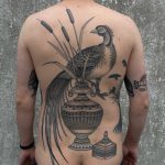 Bird and vase tattoo