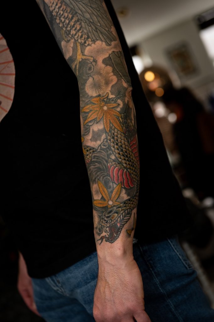 Detail of Erik’s sleeve with waves and yellow leaves.
