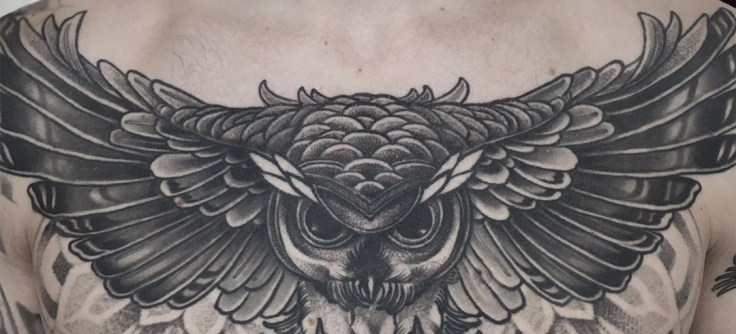 owl back tattoo on woman water
